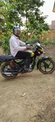 Education Secretary Alex Puhindei using his new motorbike